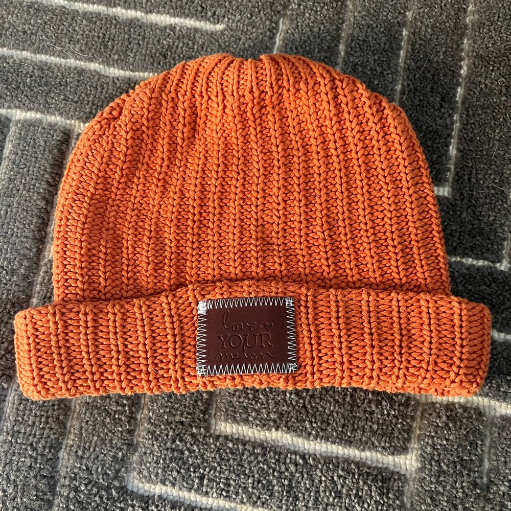 Barely worn orange love your melon hat. No rips, tears, stains or smoking.